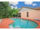 Relaxing backyard pool with a screened patio, perfect for enjoying the outdoors at 4744 Burlington Rd, Land O Lakes, FL 34639