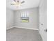 Bedroom featuring neutral paint, carpet, and a window with blinds at 4773 Hickory Oak Dr, Brooksville, FL 34601