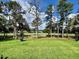 A beautiful view of the well-maintained golf course, as seen from the backyard at 4799 Hickory Oak Loop, Brooksville, FL 34601