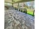 A spacious outdoor kitchen and covered patio, perfect for entertaining with views of the golf course at 4799 Hickory Oak Loop, Brooksville, FL 34601