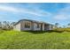 Spacious backyard with healthy green lawn, perfect for outdoor activities and relaxation at 5104 Munhal St, Port Charlotte, FL 33981
