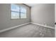 Bedroom featuring wall-to-wall carpeting and a window for natural light at 5104 Munhal St, Port Charlotte, FL 33981