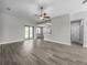 Open living space with LVP flooring, neutral paint, and recessed lighting at 5104 Munhal St, Port Charlotte, FL 33981