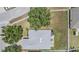 Aerial view of a home showcasing the roof, lawn, surrounding fence, and neighborhood at 5334 Tummel Ct, Wesley Chapel, FL 33545