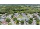 Aerial view of homes in a quiet neighborhood, each with spacious yards, lush greenery, and a peaceful atmosphere at 5334 Tummel Ct, Wesley Chapel, FL 33545