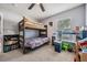 A playful bedroom featuring a wooden bunk bed and a variety of toys for children at 5334 Tummel Ct, Wesley Chapel, FL 33545