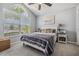 A bright bedroom with a vaulted ceiling and a large window providing ample natural light at 5334 Tummel Ct, Wesley Chapel, FL 33545