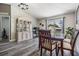 Dining area featuring modern floors, a dining table, and sliding glass doors to the backyard at 5334 Tummel Ct, Wesley Chapel, FL 33545