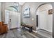 Inviting foyer with hard surface floors, art niche, and view of front door at 5334 Tummel Ct, Wesley Chapel, FL 33545