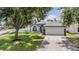 Charming single Gathering home with a well maintained lawn and landscaping at 5334 Tummel Ct, Wesley Chapel, FL 33545