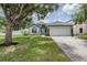 Charming single Gathering home with a well maintained lawn and landscaping at 5334 Tummel Ct, Wesley Chapel, FL 33545