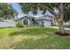 Charming single Gathering home with a well maintained lawn and landscaping at 5334 Tummel Ct, Wesley Chapel, FL 33545