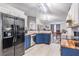 Kitchen featuring stainless steel appliances and blue cabinets with wooden countertops at 5334 Tummel Ct, Wesley Chapel, FL 33545