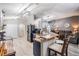 Open concept kitchen with island seating, stainless appliances and access to living area at 5334 Tummel Ct, Wesley Chapel, FL 33545