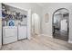 A well-organized laundry room with modern washer and dryer units and ample storage space at 5334 Tummel Ct, Wesley Chapel, FL 33545