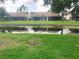 Backyard featuring a pond at 5530 Salem Square N Dr, Palm Harbor, FL 34685