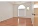 Bedroom with laminate floors, a large window, and neutral-painted walls at 5530 Salem Square N Dr, Palm Harbor, FL 34685