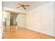 Bright bedroom features a ceiling fan, and mirror closet at 5530 Salem Square N Dr, Palm Harbor, FL 34685