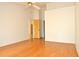 Bedroom with laminate flooring, ceiling fan, and view of an open doorway at 5530 Salem Square N Dr, Palm Harbor, FL 34685