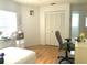 Bright bedroom with large closet and hardwood floors at 5530 Salem Square N Dr, Palm Harbor, FL 34685