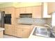 Kitchen features stainless steel sink and appliances at 5530 Salem Square N Dr, Palm Harbor, FL 34685