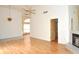 Open living area with fireplace, stylish lighting, and hardwood floors at 5530 Salem Square N Dr, Palm Harbor, FL 34685