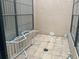 Private patio with neutral color and textured walls, awaiting your personal touch at 5530 Salem Square N Dr, Palm Harbor, FL 34685