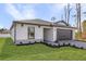 Well-manicured front yard with lush green grass surrounds this quaint single-Gathering home at 5830 Babian Rd, North Port, FL 34291