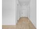 Bright and open hallway features beautiful flooring and fresh, white paint throughout at 5830 Babian Rd, North Port, FL 34291