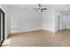 Spacious living room with tiled floor and a ceiling fan offers great natural light at 5830 Babian Rd, North Port, FL 34291