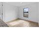 Well-lit bonus room features tile floors, neutral paint and a large window at 5830 Babian Rd, North Port, FL 34291