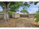 Backyard with a storage shed and wooden fences, perfect for outdoor hobbies at 6497 43Rd N Ave, Kenneth City, FL 33709
