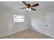 This bedroom offers carpet, a ceiling fan, one window, and closet space at 6497 43Rd N Ave, Kenneth City, FL 33709
