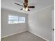 Bright bedroom with ceiling fan and ample light from the outdoor window at 6497 43Rd N Ave, Kenneth City, FL 33709
