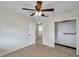 Bright bedroom featuring a ceiling fan and closet, ready for personalization at 6497 43Rd N Ave, Kenneth City, FL 33709