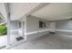 Wide carport offering covered parking and easy access to the home's entrance at 6497 43Rd N Ave, Kenneth City, FL 33709
