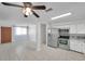 Open kitchen featuring stainless steel appliances, light countertops, and a view into the living area at 6497 43Rd N Ave, Kenneth City, FL 33709