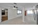 Spacious living area with tile flooring, connecting the kitchen and other rooms in an open layout at 6497 43Rd N Ave, Kenneth City, FL 33709