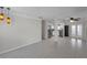 Open-concept layout with tile flooring connecting the living area to a modern kitchen at 6497 43Rd N Ave, Kenneth City, FL 33709