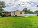 Spacious backyard with a covered patio, perfect for entertaining or relaxing at 6706 S Trask St, Tampa, FL 33616