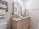 Bright bathroom featuring a double vanity, neutral decor, and modern light fixtures at 6706 S Trask St, Tampa, FL 33616