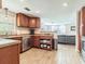 Open-concept kitchen with updated appliances and stylish cabinets overlooking the living area at 6706 S Trask St, Tampa, FL 33616