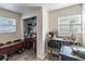 Kitchenette featuring a microwave, sink, desk, and storage space at 6706 S Trask St, Tampa, FL 33616