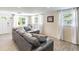 Bright living room with large windows, neutral decor, and a cozy seating arrangement at 6706 S Trask St, Tampa, FL 33616