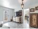 Bright living room showcasing a dresser and a doorway leading to the kitchen at 6706 S Trask St, Tampa, FL 33616