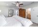 View of the spacious bedroom showcasing a decorative mirror and en suite bathroom at 6706 S Trask St, Tampa, FL 33616