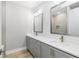 Clean bathroom featuring double sinks, vanity, and a walk-in shower at 6757 Summit View Dr, Brooksville, FL 34601