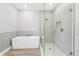 Modern bathroom with a large soaking tub and walk-in shower at 6757 Summit View Dr, Brooksville, FL 34601