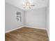 Cozy bedroom with a ceiling fan and large window at 6757 Summit View Dr, Brooksville, FL 34601
