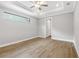 Bright bedroom with ceiling fan, recessed lighting, and hardwood floors at 6757 Summit View Dr, Brooksville, FL 34601